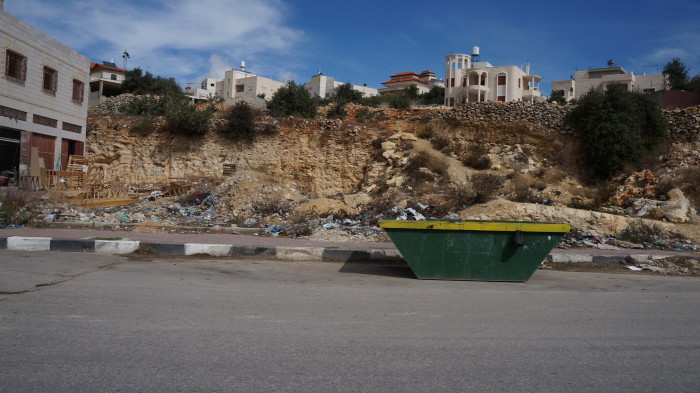a typical Hebron scene - Palestinian cities have a terrible problem with rubbish. This new initiative, putting skips every km or so, which are emptied fairly regularly, seems to be working.
